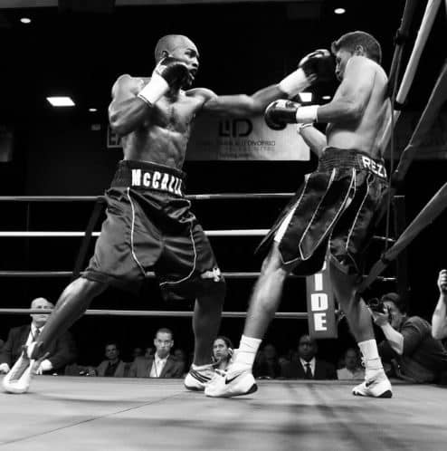 professional boxers fighting in a ring