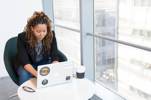 black woman working on laptop